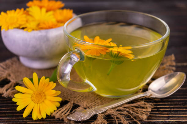 istock Fragrant tea from calendula flowers. Close-up. 1408721691