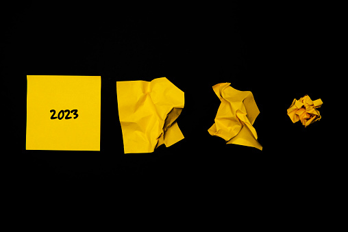 Yellow adhesive notes on black background.