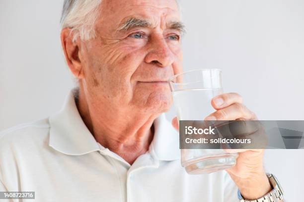 Senior Man Drinking Water Stock Photo - Download Image Now - 70-79 Years, Active Seniors, Adult