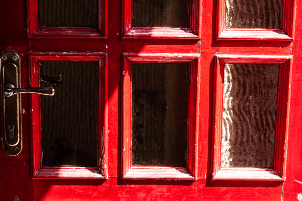 istock red door with golden door handle in the bright sun 1408727708