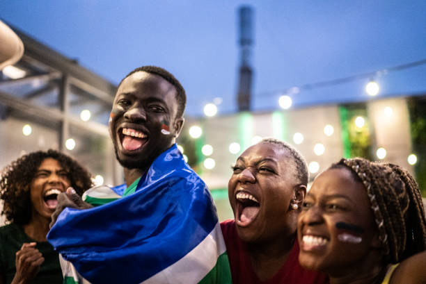istock Friends celebrating team scoring a goal outdoors 1408728006
