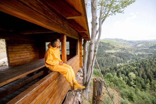 istock Woman enjoys great mountain landscape 1408728054