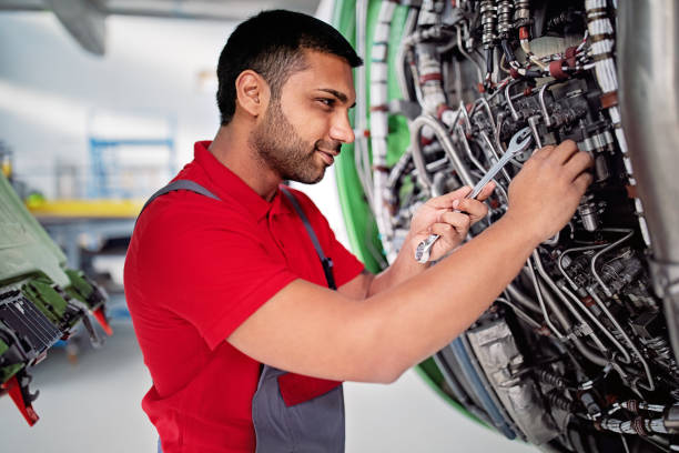 istock Aircraft mechanic is working on engine in an airplane hangar 1408728314