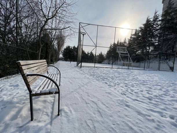 istock Park and Bench in Snowy Weather 1408730522