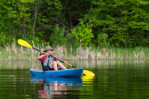 istock Girl Kayaking on Lake On Summer Day 1408733061