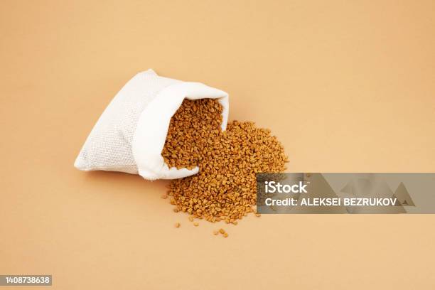 Fenugreek Seeds In White Pouch On Beige Background Shambhala Or Helba Seeds Is Traditional Indian Seasoning And Ingredient Ayurvedic Food Stock Photo - Download Image Now