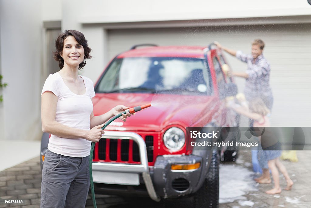 Family washing car together  Car Wash Stock Photo