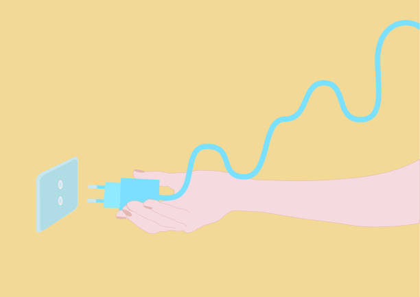 istock Hand unplugging a plug because the price of light goes up 1408739872