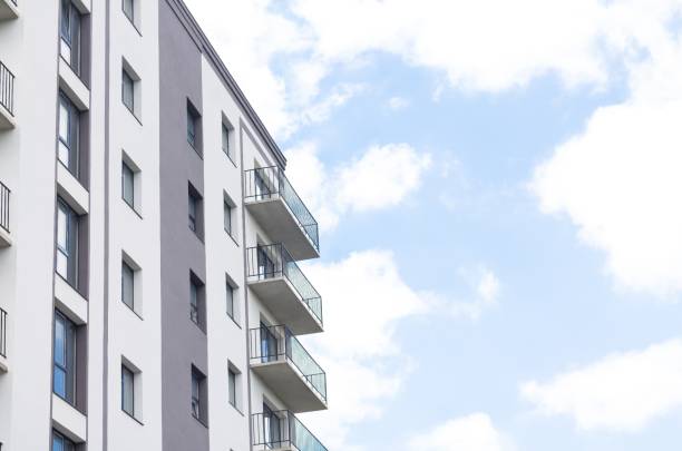 istock Modern apartment building facade on sky background 1408742440