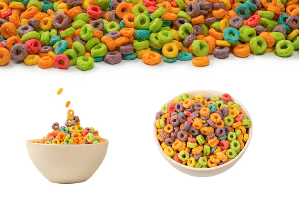istock Colorful rings cereal spill out into a bowl. Breakfast. Isolated. 1408746610