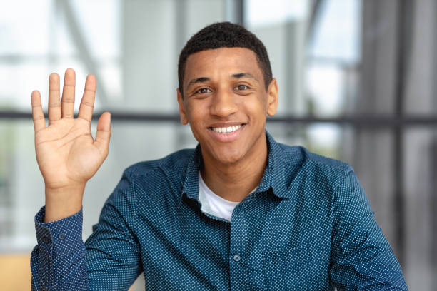 istock Remote work, online interview, video conference concept. Video call screen with smiling African American man introducing himself. Headshot of a positive male looking at the camera and smiling friendly 1408746707