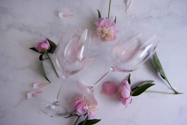 istock A glass of wine flower peony on a light background 1408747837