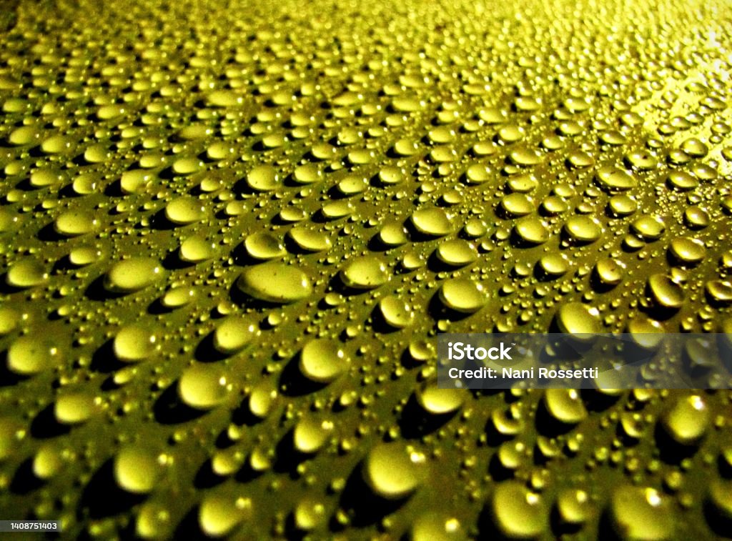 Rain drops - abstract design Many rain drops on a surface making an abstract design. Surface Tension Stock Photo