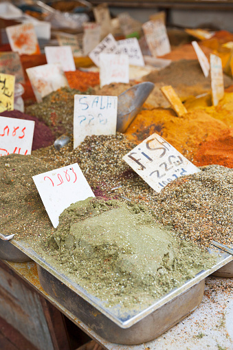 Vibrant spices - za'atar, salat, and fish spices - at a stall in Carmel Market, Tel Aviv