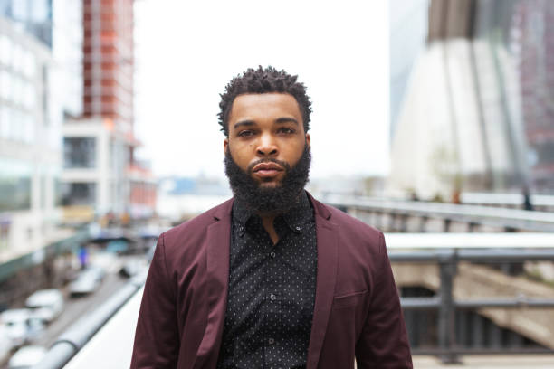 Black businessman in front of the office building. Hudson Yards, New York City, USA