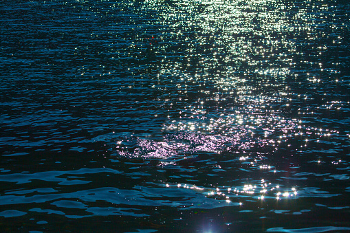 Stars reflection in the sea . Glowing at water surface