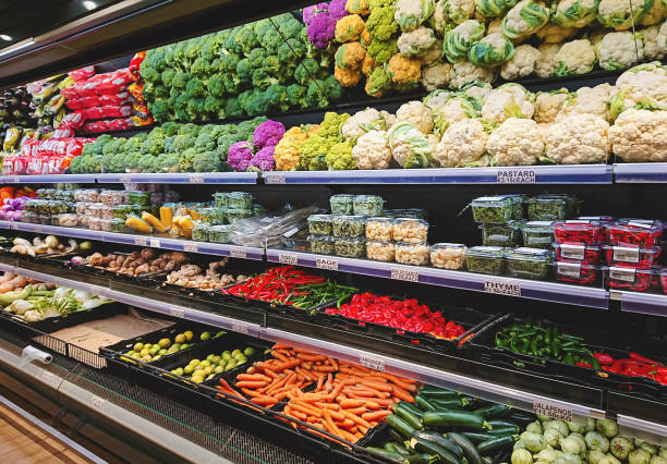 fruits and vegetables on shop stand in supermarket grocery store - yan imagens e fotografias de stock