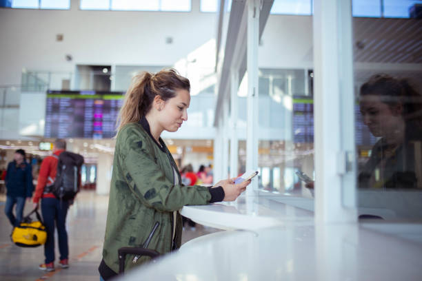 istock The passenger shows the vaccination passport at the counter. 1408772428
