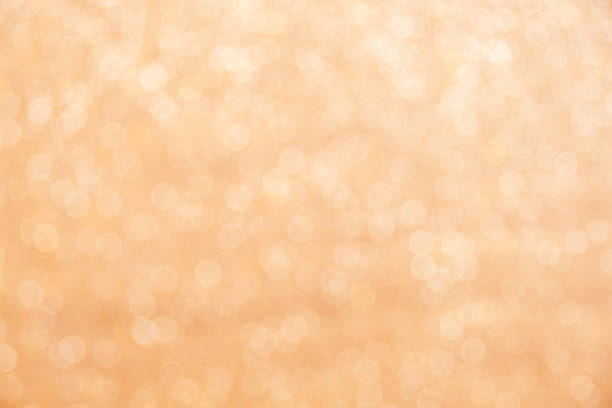 istock Gold light shiny bokeh abstract blur background with bright round defocus golden pattern 1408772493