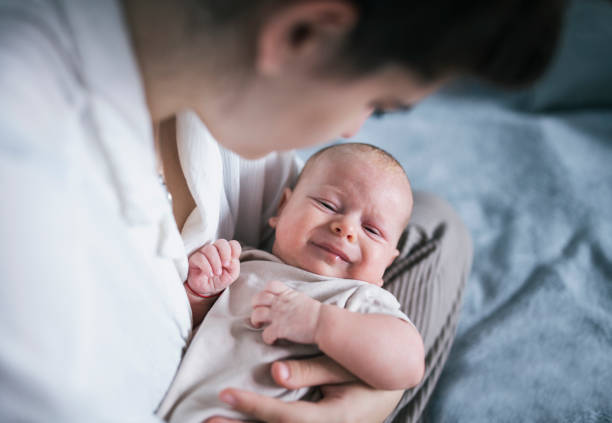 istock Mother holding crying baby boy. 1408772551