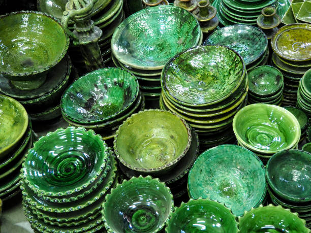 Pile of green plates or cups displayed at market in Morocco stock photo