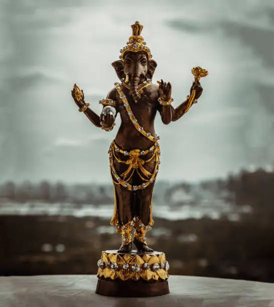 Bronze figurine of Lord ganesha. Ganesha is hindu god of Success that artists and people worship, Copy space, Selective focus.