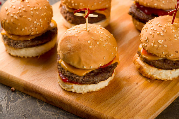 istock Mini cheeseburger on the Board macro close up, canapes 1408774563
