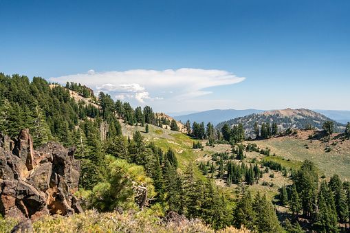 Panoramic view of famous Yosemite Valley with beautiful Merced river on a scenic sunny day with blue sky in summer, Yosemite National Park, California, USA