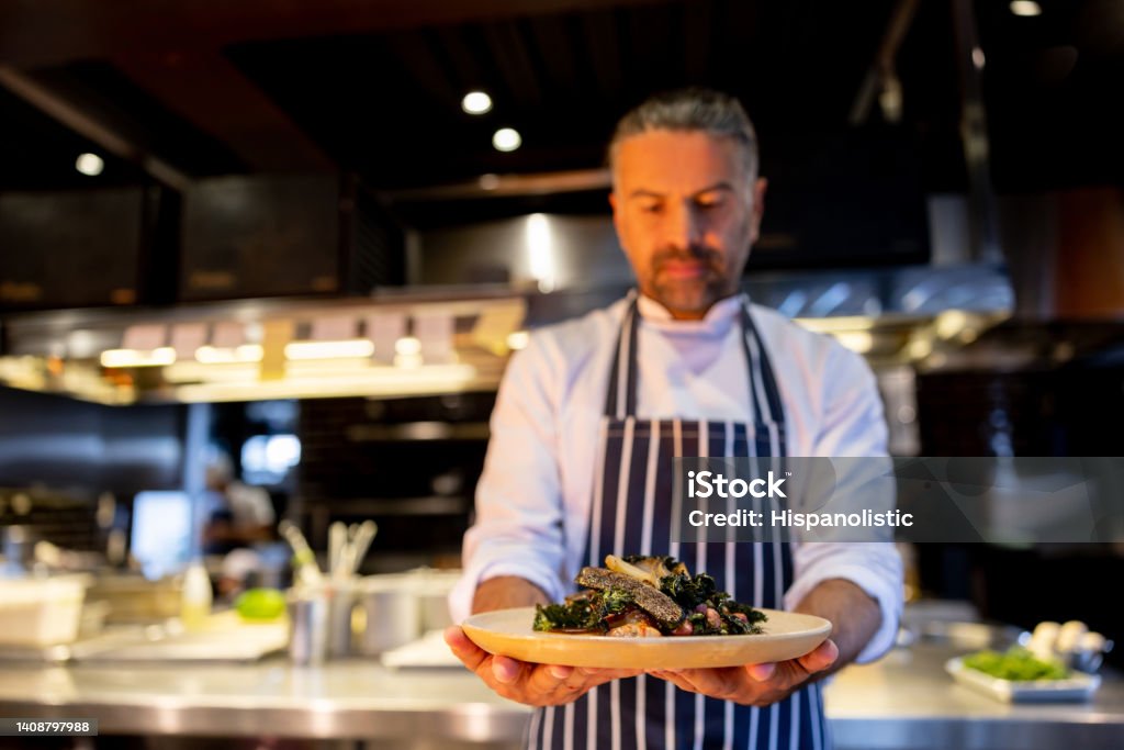 Cooking Chef Plate Chef At A Restaurant Presenting A Plate Stock Photo - Download Image ...