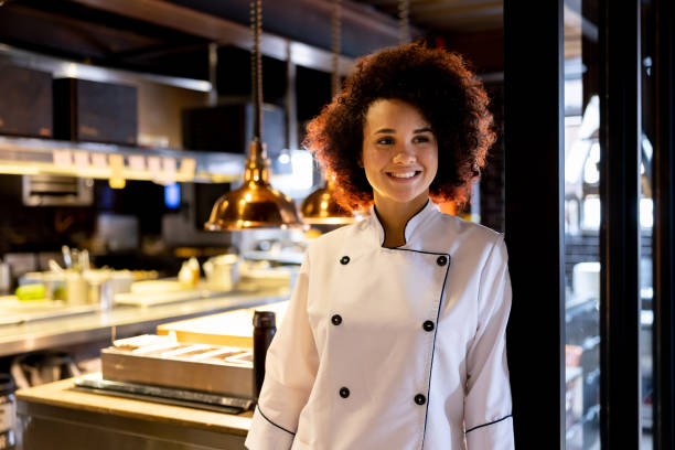 istock Happy chef working in the kitchen at a restaurant 1408798002