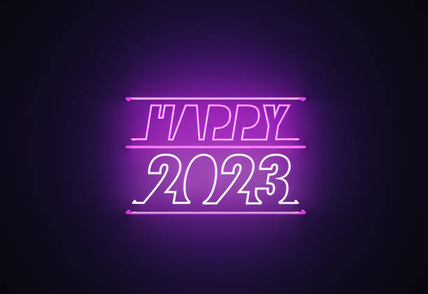 istock Purple Neon Light Writes Happy 2023 on Black Background 1408800465
