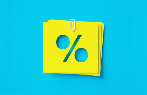 istock Percentage Sign Written Cut Out Yellow Adhesive Notes Sitting Over Blue Background 1408800642