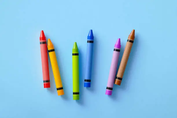 Photo of Colorful Crayons On Blue Background