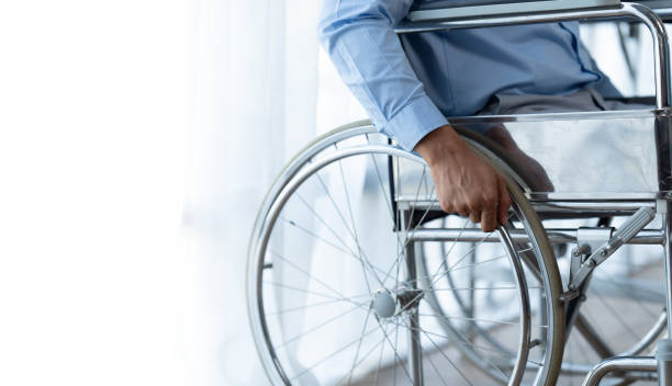 istock Businessman suffering from accident sickness in a wheelchair, sickness concept while working in the office, copy space. 1408802790
