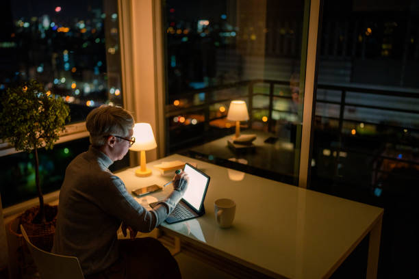 istock Senior Business woman working at night. 1408804807