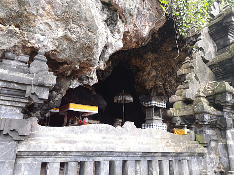 The bat cave of Pura Goa Lawah, a Hindu temple in Klungkung, Bali, Indonesia. Pura Goa Lawah is noted for built around a cave opening which is inhabited by bats, hence its name, the Goa Lawah or \