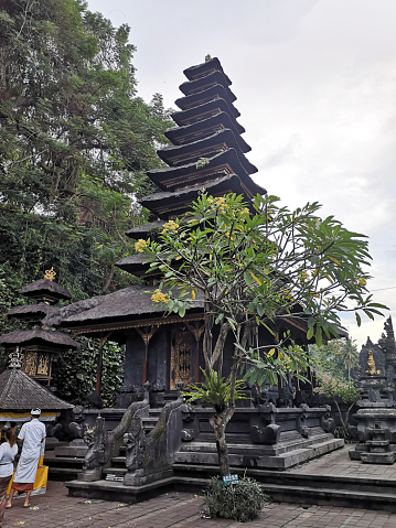 Locals in Pura Goa Lawah, a Hindu temple in Klungkung, Bali, Indonesia. Pura Goa Lawah is noted for built around a cave opening which is inhabited by bats, hence its name, the Goa Lawah or 