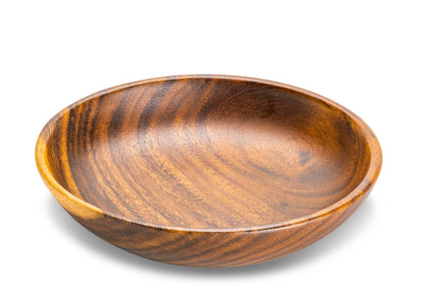 istock High angle view of single wooden plate isolated on white background. 1408810929
