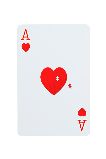 Ace of hearts playing card with a piece of heart missing made from jigsaw puzzle, isolated on white with clipping path.\nFinal Piece of the Puzzle.