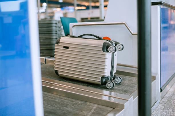 Luggage at check in counter Bring it to conveyor belt and weight at the international airport with copy space airport check in counter stock pictures, royalty-free photos & images