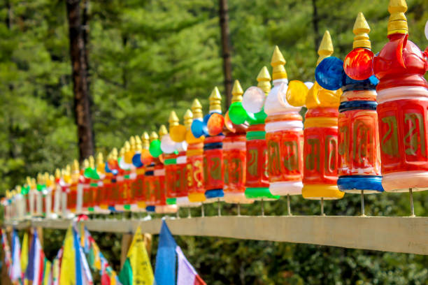 Colourful prayer wheels This photo was clicked in Paro, Bhutan. buddhist prayer wheel stock pictures, royalty-free photos & images