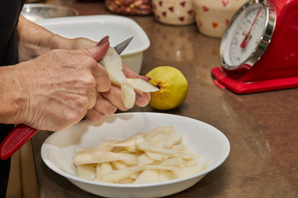Six (6) Organic Pears in a bowl on a wooden table