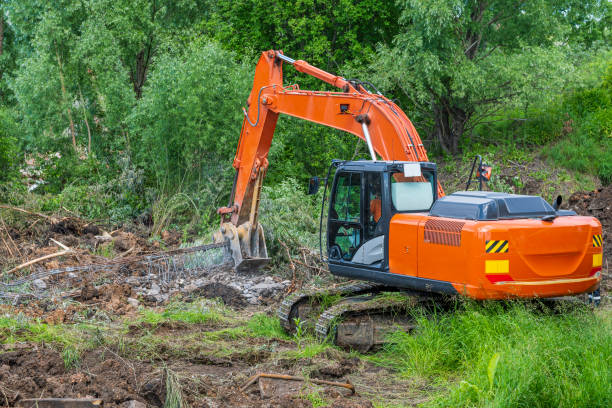istock Excavator - crusher breaks (crushes) reinforced concrete building structures to clean metal from concrete. 1408817457
