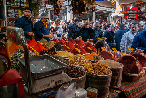 istanbul,turkey november 3, 2009 colorful and aromatic spice market of istanbul, people moving inside a store buying spices.