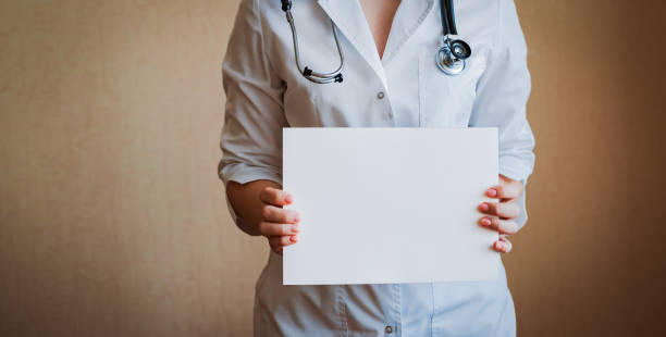 istock Doctor holding blank white banner 1408820327