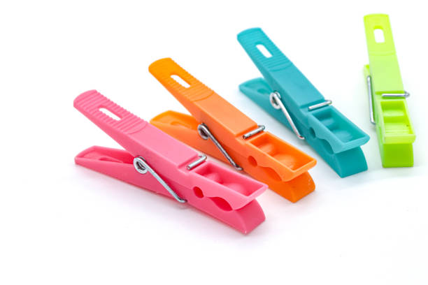 istock plastic clothespins with different colors like green, pink, blue, orange on white background 1408823810