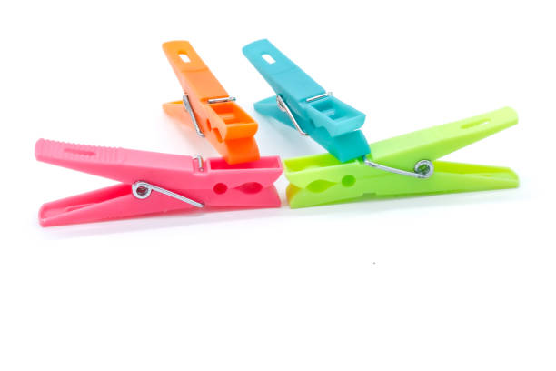 istock plastic clothespins with different colors like green, pink, blue, orange on white background 1408823828