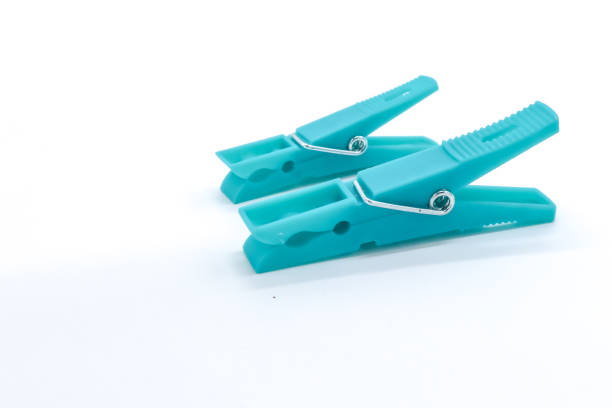 istock plastic clothespins with different colors like green, pink, blue, orange on white background 1408823829