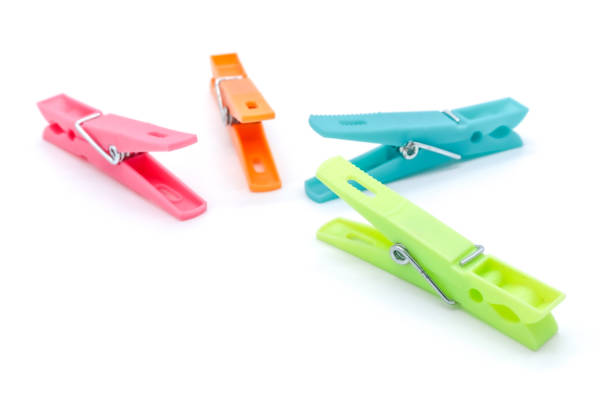 istock plastic clothespins with different colors like green, pink, blue, orange on white background 1408823851