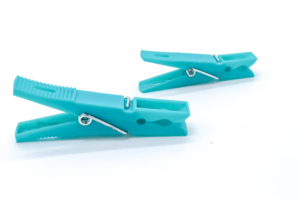 istock plastic clothespins with different colors like green, pink, blue, orange on white background 1408823887